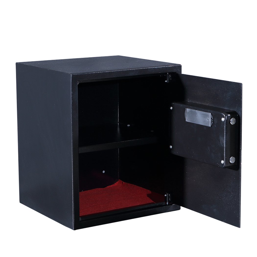 Black safe with open door on a white background