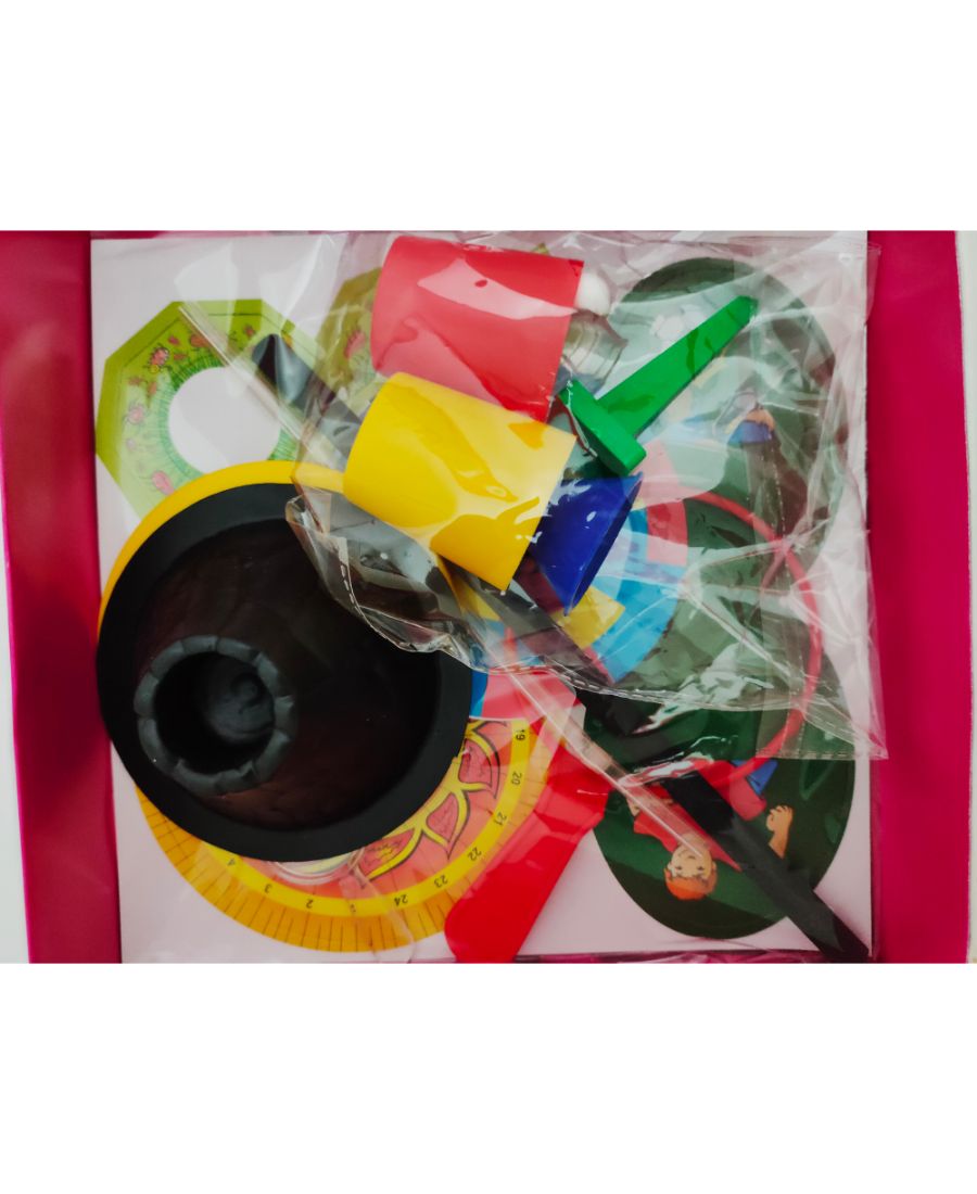 Colorful toy set with various shapes and a black central component on a white background.