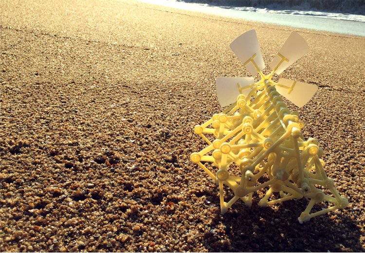 Yellow toy structure on a sandy beach