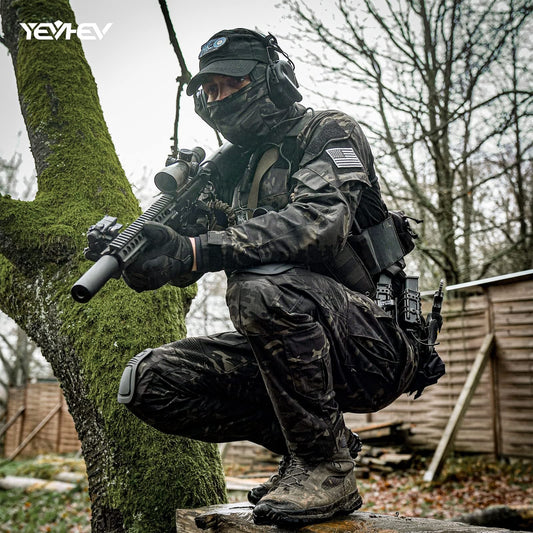 Person in tactical gear crouching behind a tree in an outdoor setting