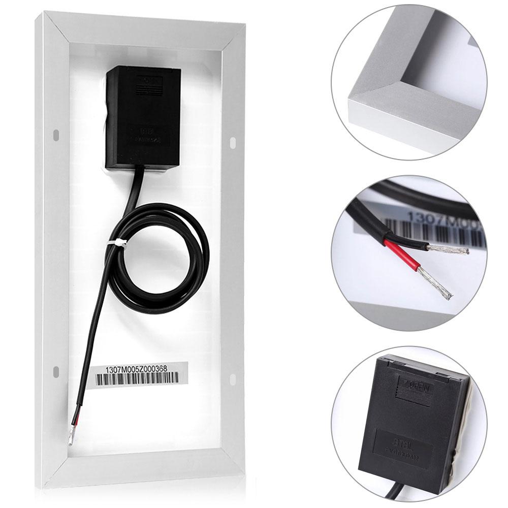 Black electronic device with cable and close-up details on a white background