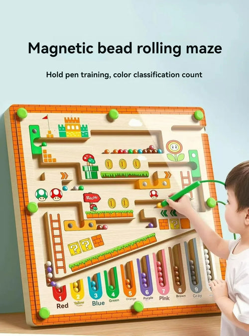Child playing with a magnetic bead rolling maze educational toy