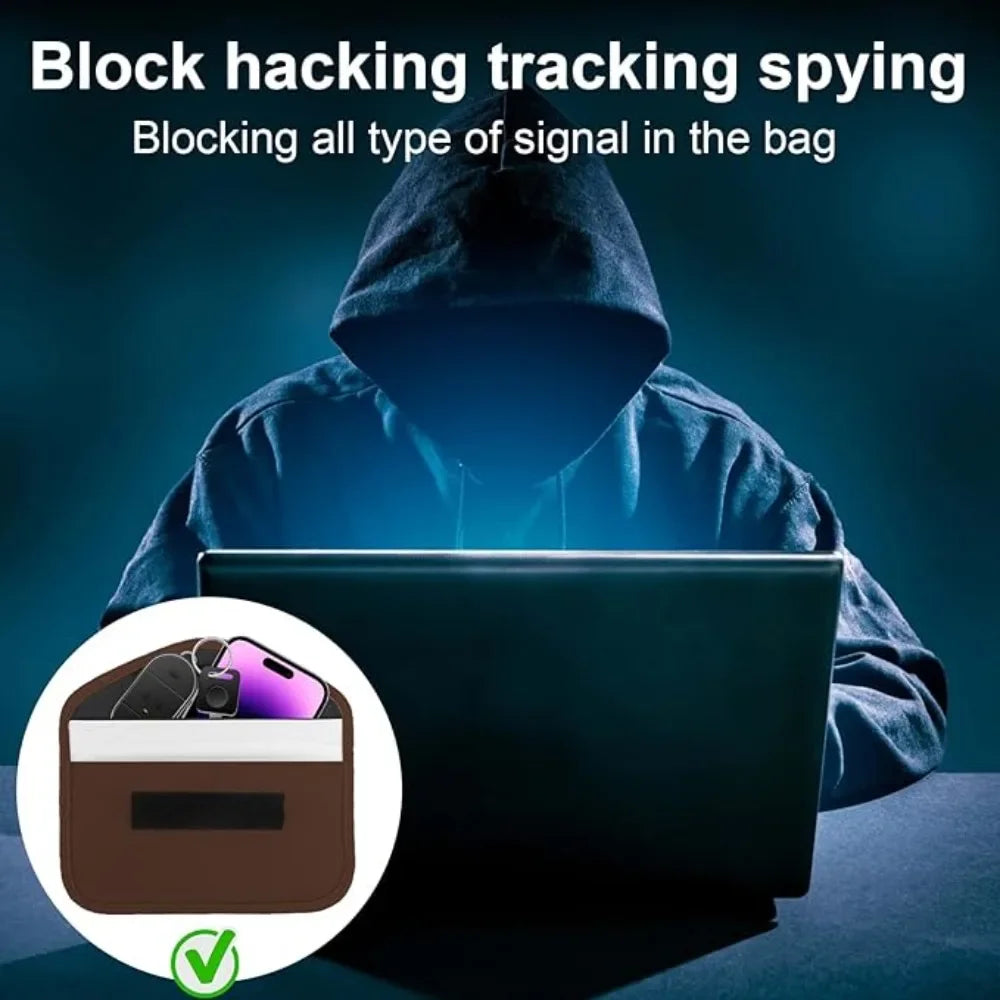 Person in a hood using a laptop with a focus on signal blocking, set against a dark background.