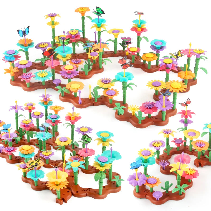 Colorful plastic flowers and butterflies on a white background