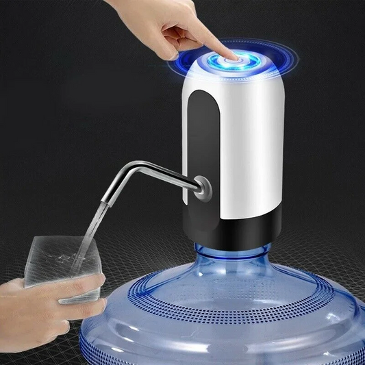 Hand pressing a button on a water dispenser with a glass being filled.