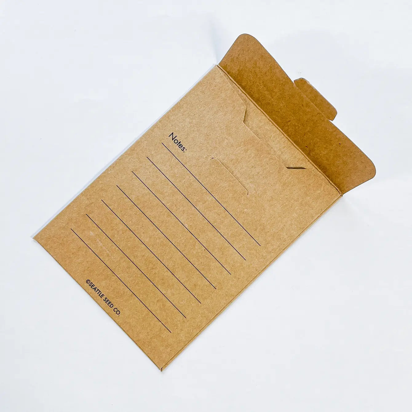 Kraft paper notepad with lined pages on a white background